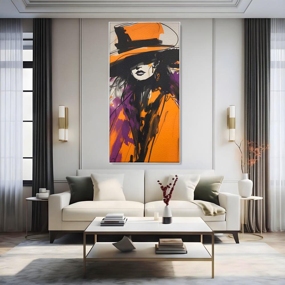 Tablou canvas cu ilustratie portret femeie cu palarie portocalie, in rama de aluminiu argintiu, pe perete intr-un living